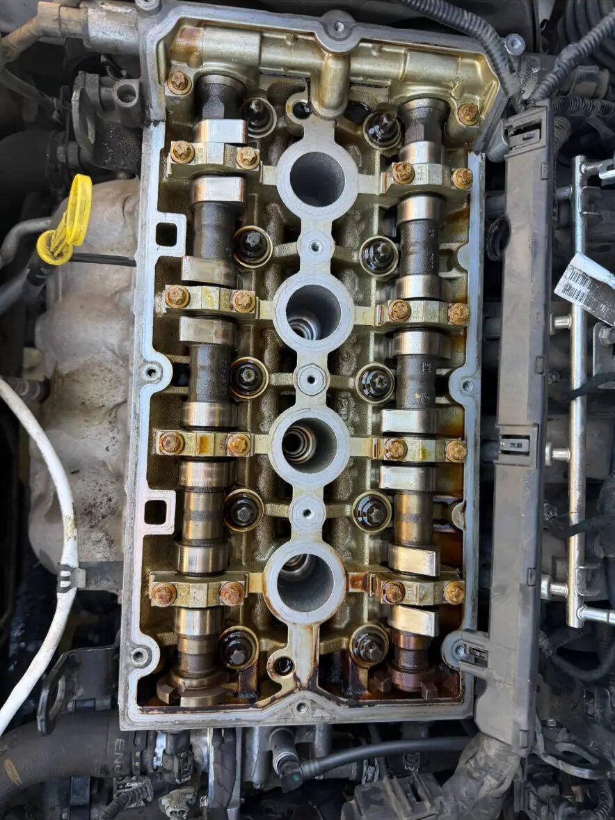 Cylinder head with camshafts during a timing job