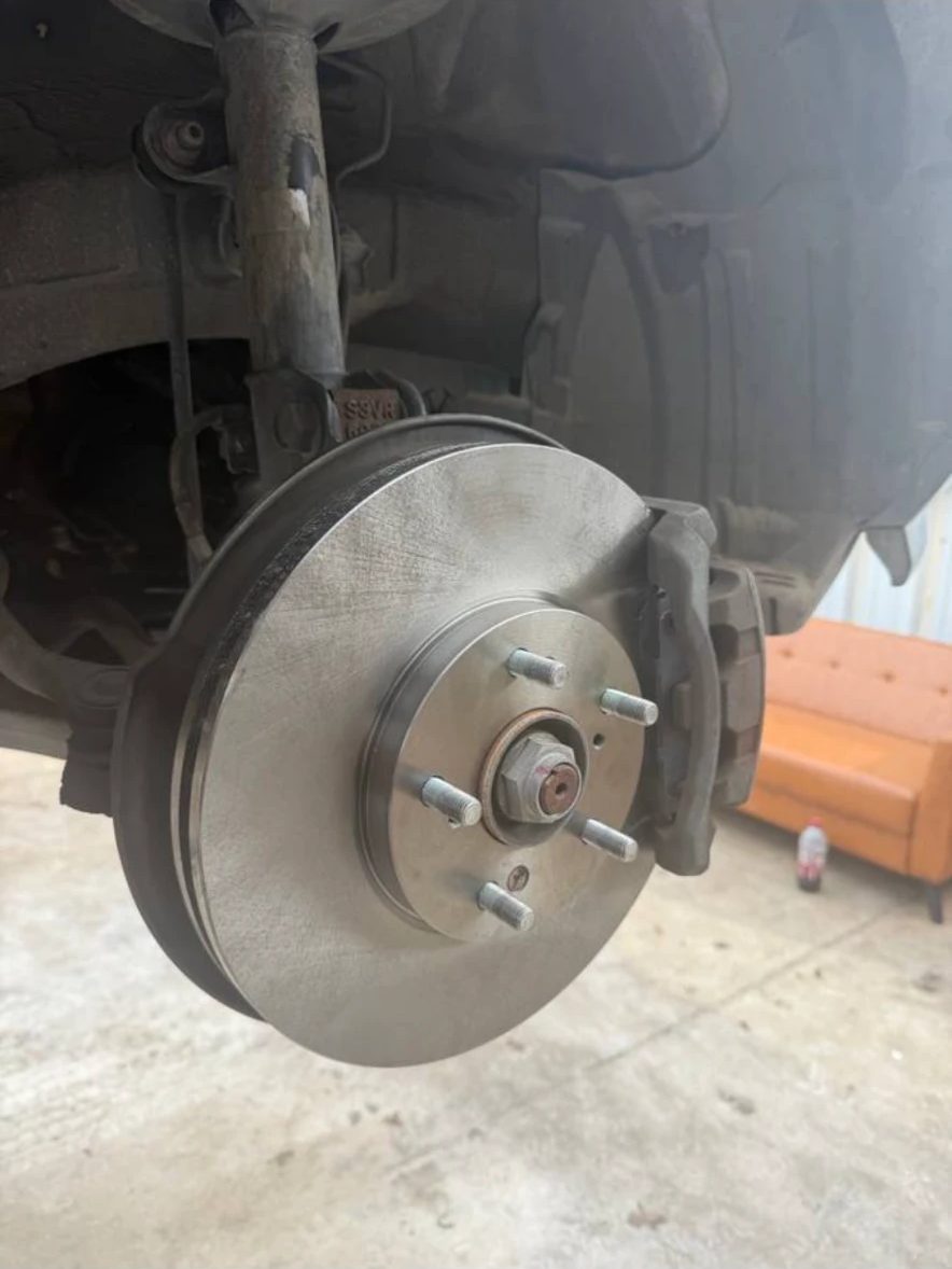 Transmission oil pan and axle shaft viewed from the lift
