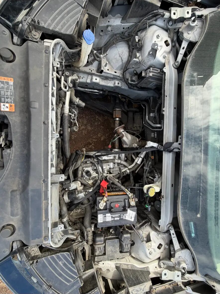Engine bay stripped down during a full engine swap