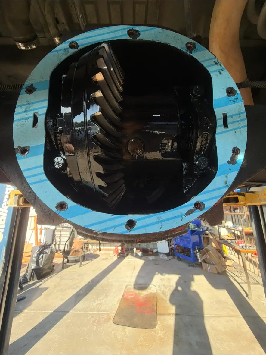 Rear differential opened up showing ring and pinion gears