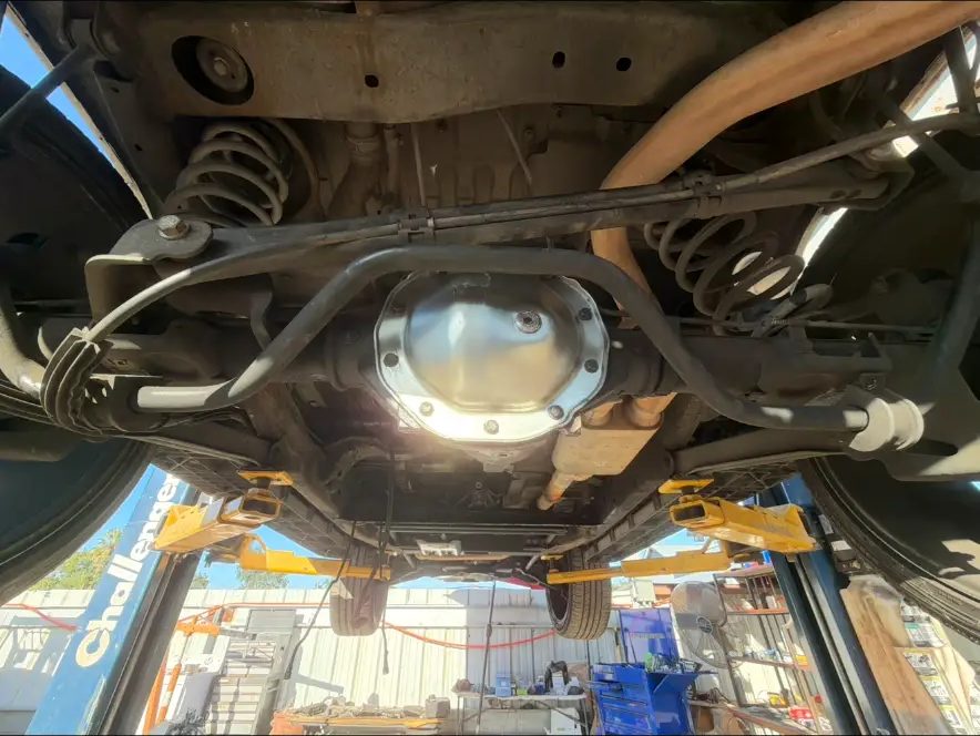 Rear axle and suspension with a fresh differential cover installed