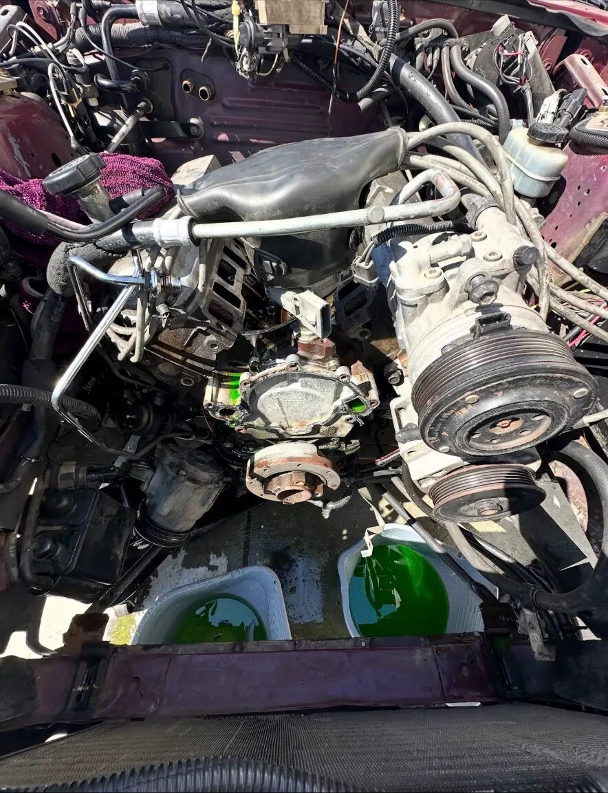 Engine and accessory drive out of a truck for repair