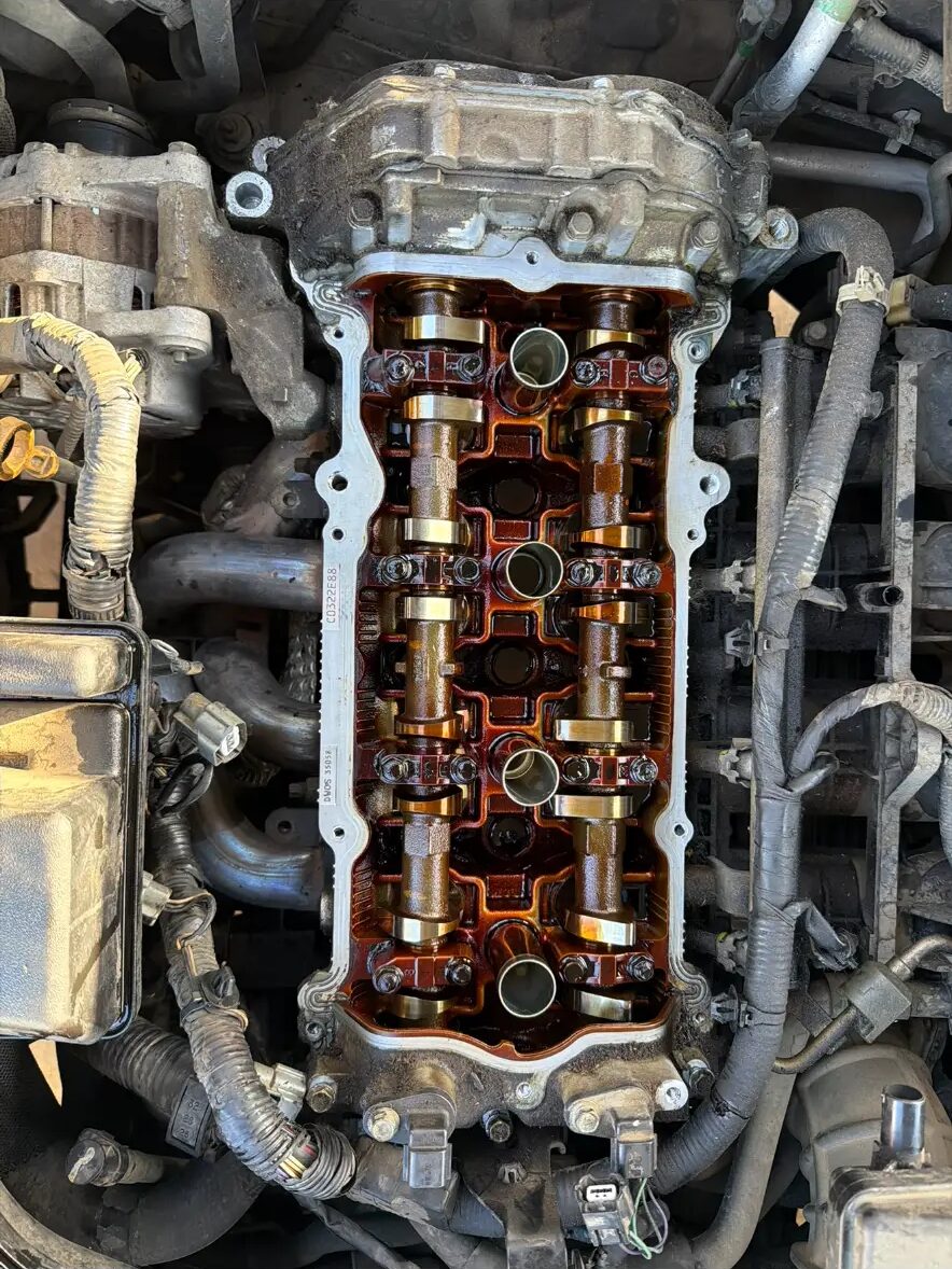 Valve cover off showing camshafts and rocker assembly
